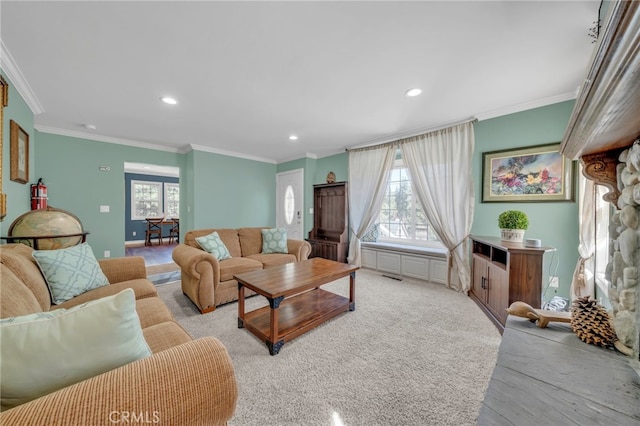 living room with light carpet, crown molding, and a fireplace