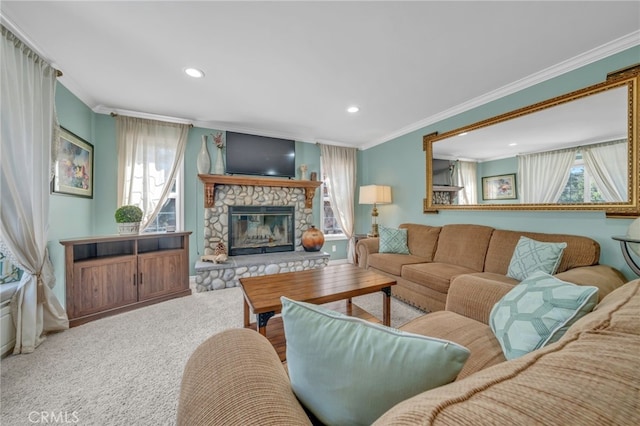 carpeted living room featuring crown molding and a stone fireplace