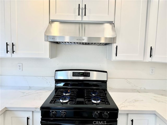 kitchen featuring white cabinetry, black gas range, and range hood