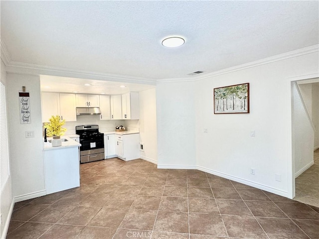 kitchen with light stone countertops, white cabinets, dishwasher, and sink