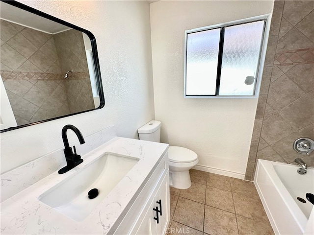 full bathroom featuring toilet, tiled shower / bath combo, tile patterned floors, and vanity