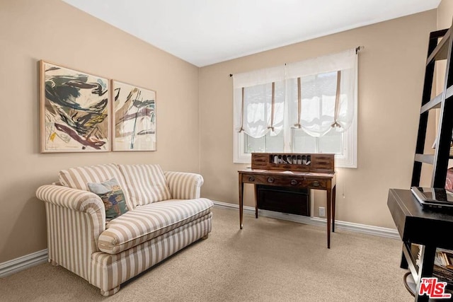 living area featuring light colored carpet