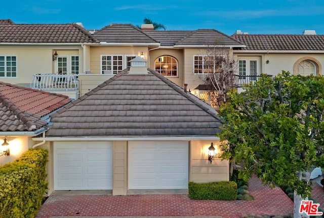 view of front of property with a garage