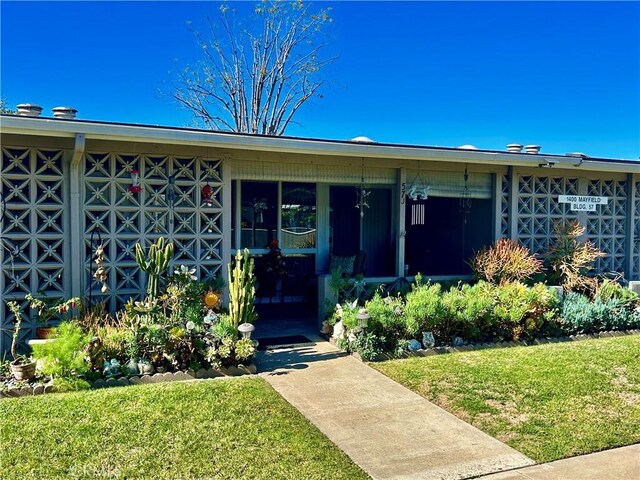 exterior space featuring a front lawn