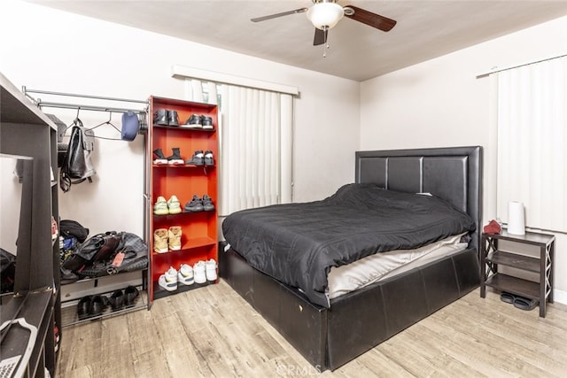 bedroom featuring ceiling fan and wood-type flooring