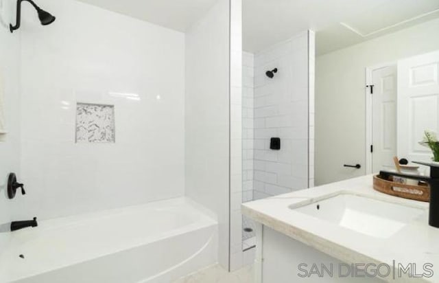 bathroom featuring shower with separate bathtub and vanity