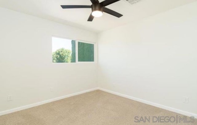 carpeted empty room with ceiling fan