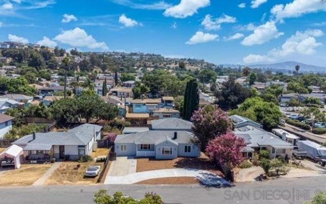 birds eye view of property featuring a mountain view