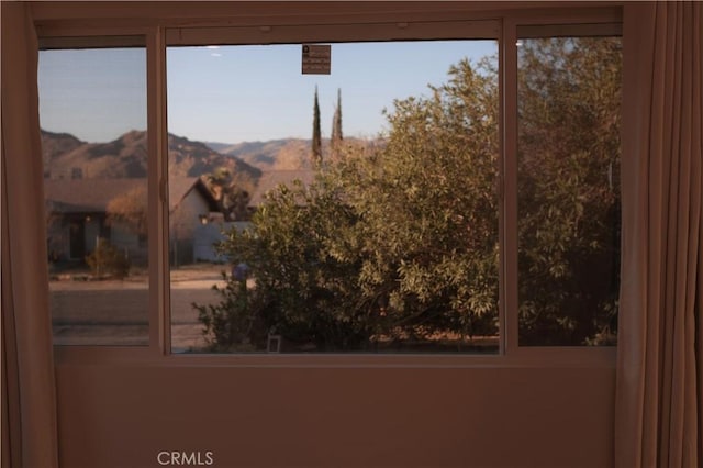 interior space featuring a healthy amount of sunlight and a mountain view