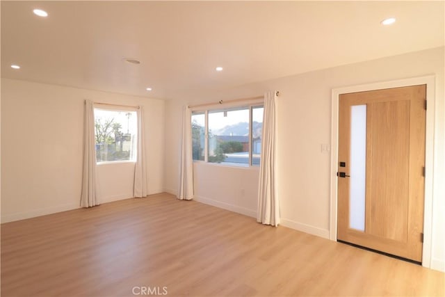 doorway with light hardwood / wood-style floors