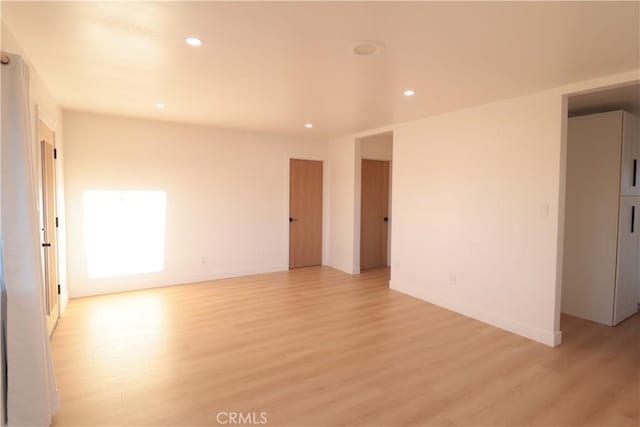 empty room with light wood-type flooring