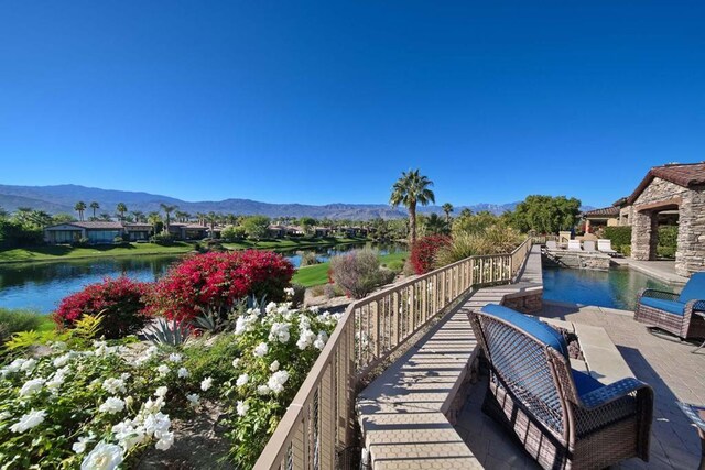 exterior space with a water and mountain view