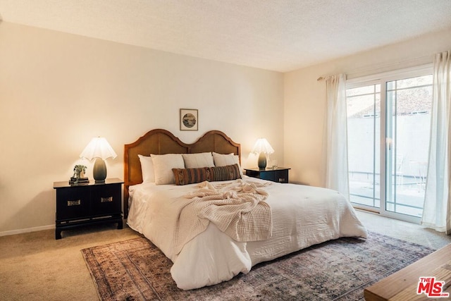 bedroom featuring access to outside and light colored carpet