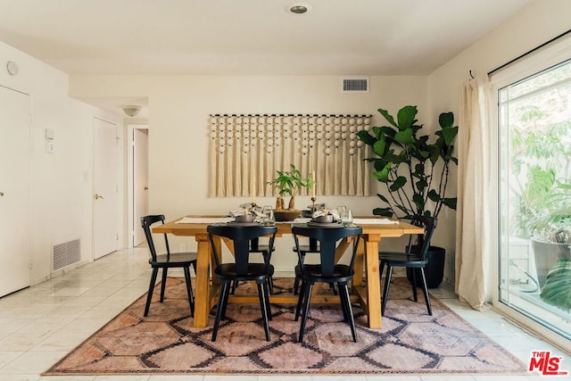 dining room featuring light tile patterned flooring