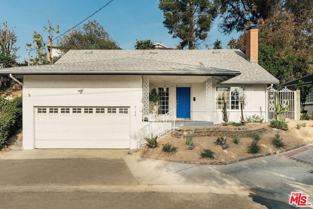 view of front of property with a garage