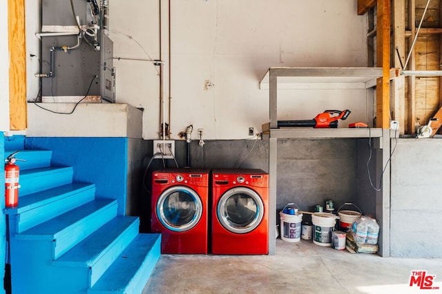 laundry room with washing machine and clothes dryer