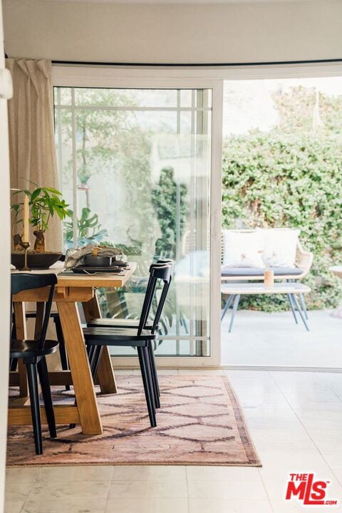 doorway featuring tile patterned flooring