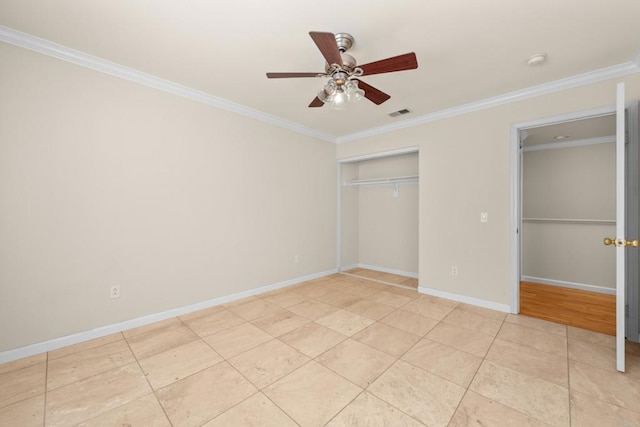 unfurnished bedroom with ceiling fan, ornamental molding, a closet, and light tile patterned floors