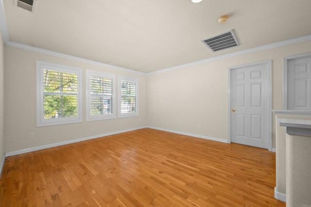 unfurnished room featuring crown molding and light hardwood / wood-style floors