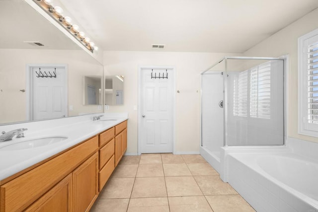 bathroom featuring vanity, tile patterned floors, and shower with separate bathtub