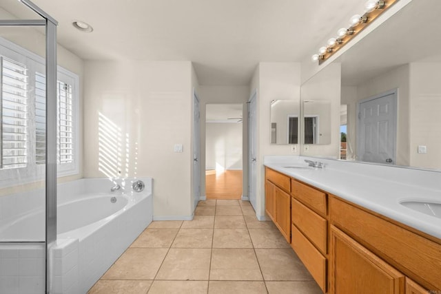 bathroom featuring vanity, independent shower and bath, and tile patterned flooring