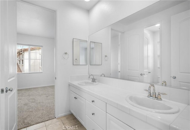 bathroom with tile patterned floors and vanity