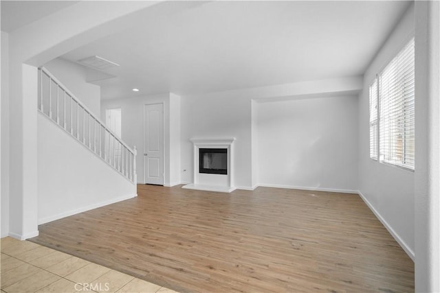 unfurnished living room with light wood-type flooring