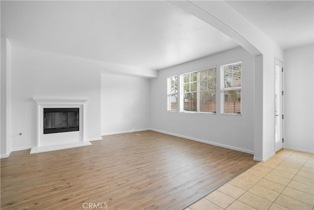 unfurnished living room with light hardwood / wood-style floors