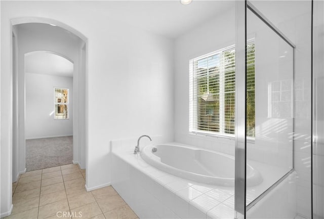 bathroom with plus walk in shower and tile patterned flooring