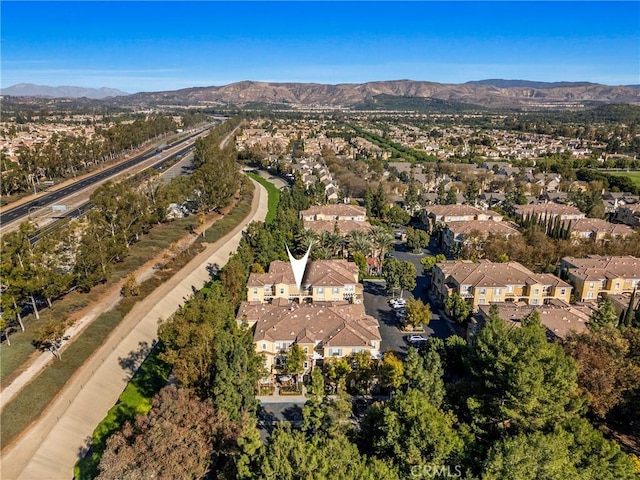 birds eye view of property featuring a mountain view and a residential view