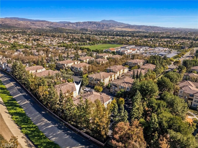 birds eye view of property with a residential view and a mountain view