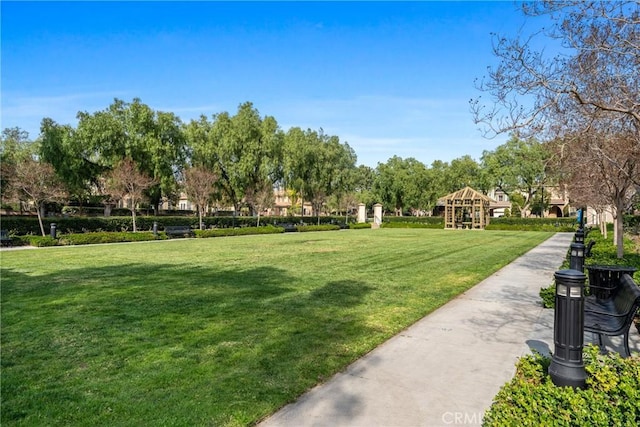 view of community with a yard and a gazebo