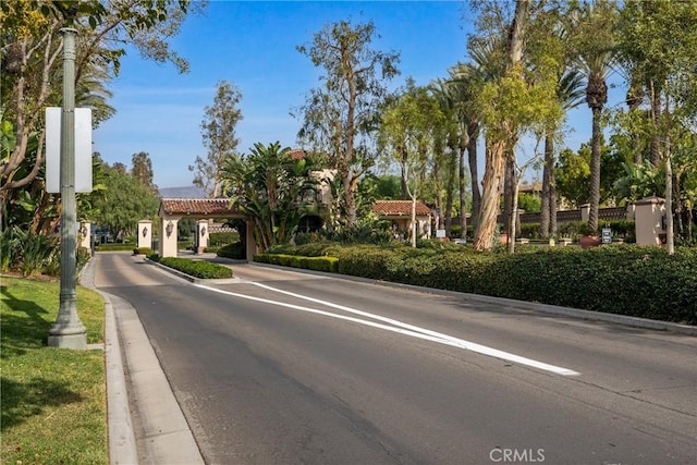 view of road featuring curbs