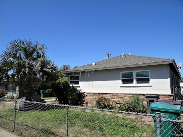 view of home's exterior with a yard