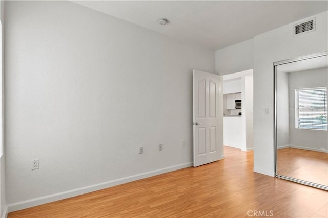 unfurnished bedroom featuring light hardwood / wood-style floors