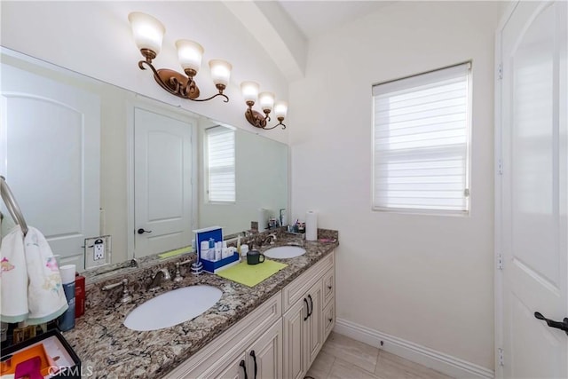 bathroom featuring tile patterned floors and vanity