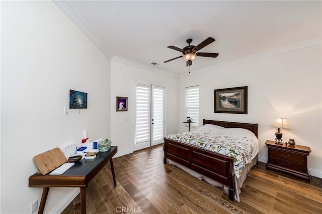 bedroom with ceiling fan, dark hardwood / wood-style flooring, and ornamental molding