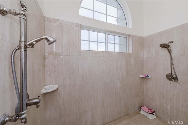 bathroom with tiled shower