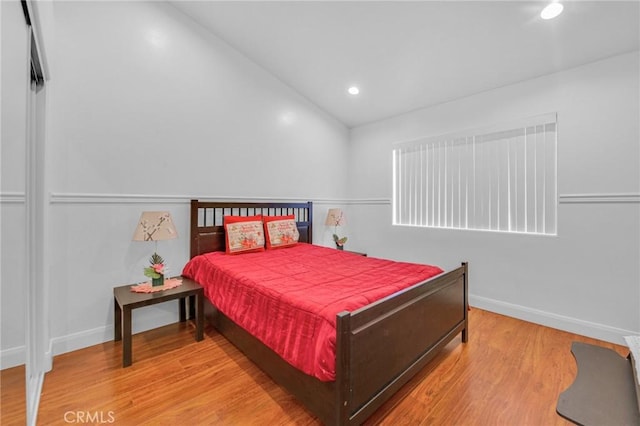 bedroom with hardwood / wood-style floors