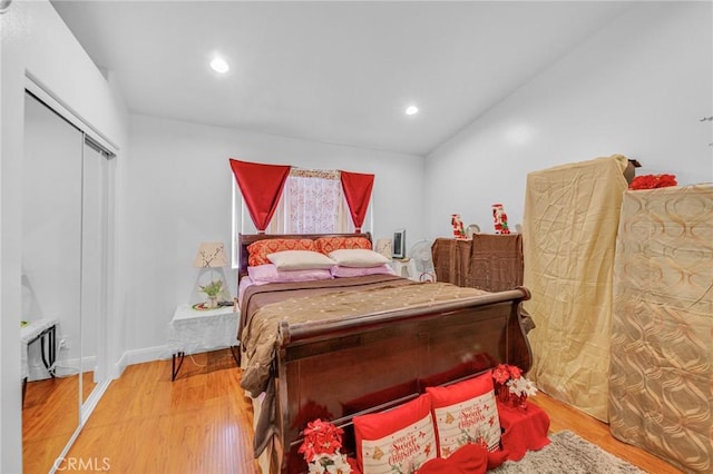 bedroom featuring hardwood / wood-style flooring and a closet