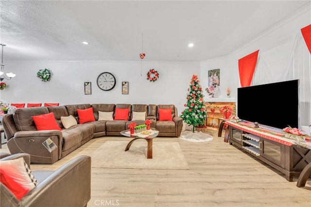 living room with crown molding and light wood-type flooring