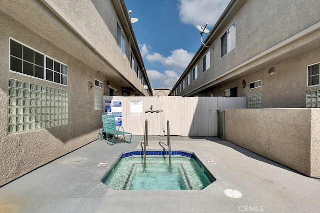 view of pool featuring a patio area and fence