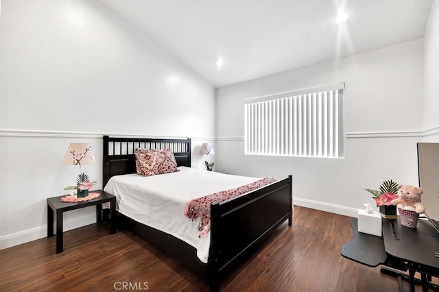 bedroom featuring lofted ceiling, recessed lighting, wood finished floors, and baseboards