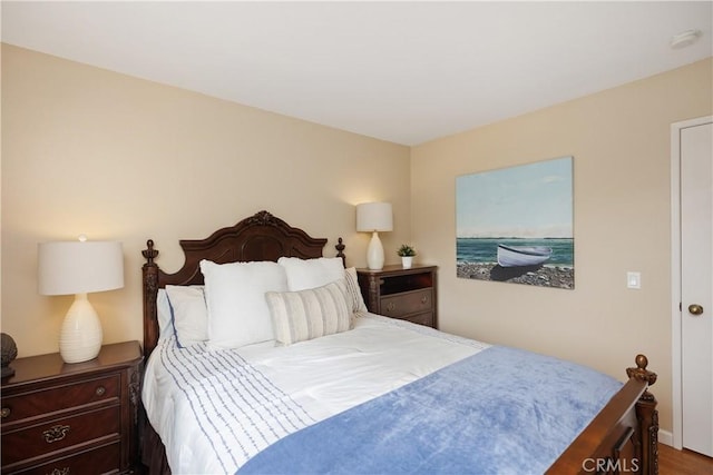 bedroom with hardwood / wood-style floors