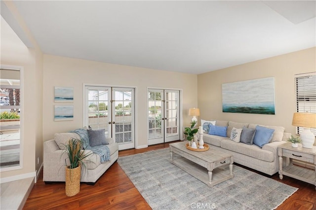 living room with french doors and dark hardwood / wood-style floors