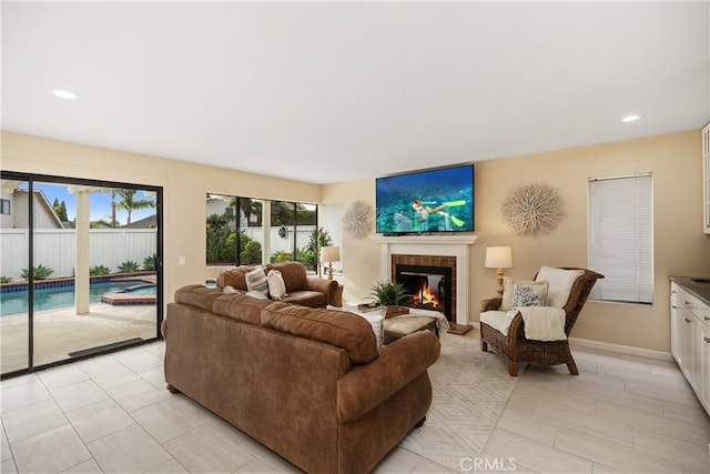 tiled living room featuring a tile fireplace