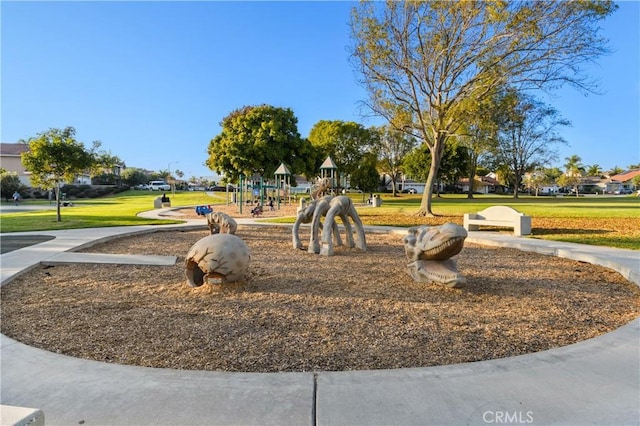 view of community with a lawn and a playground