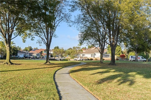 view of home's community with a yard