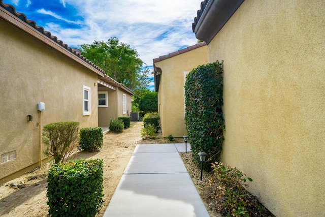 view of property exterior with cooling unit