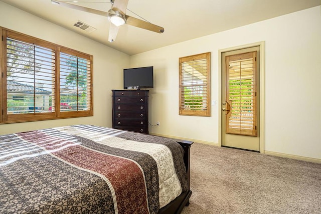 bedroom with ceiling fan and carpet